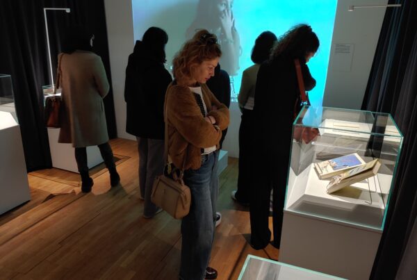 Visitors looking at objects on display